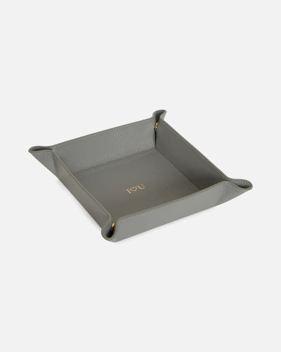 grey valet tray with gold embossed font