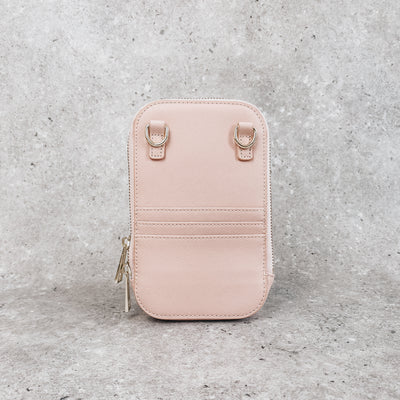 Personalised icy pink leather bag  on a grey background