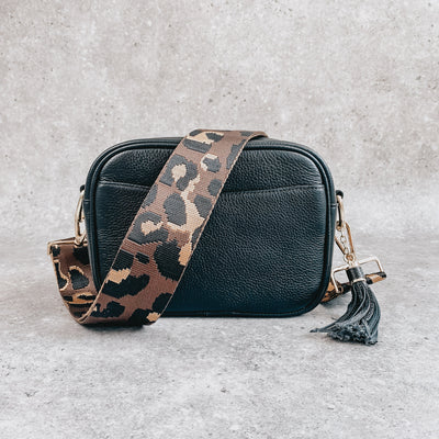 Black leather crossover bag with leopard print strap