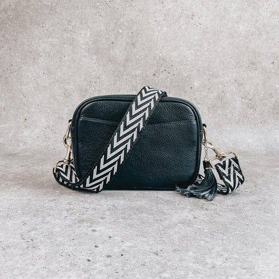 Black leather crossover bag with black and white chevron strap