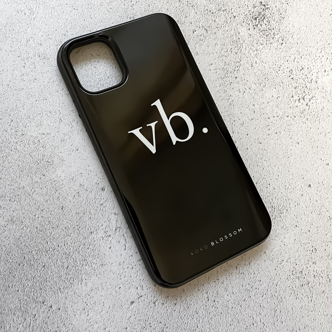 black phone case with VB in the middle.