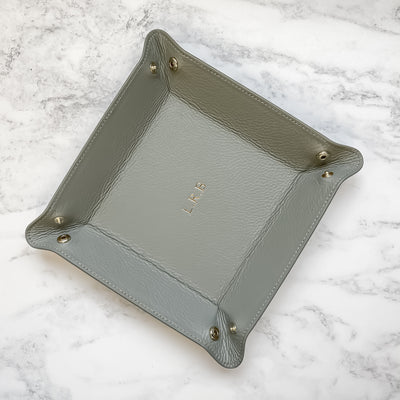 Open valet tray on a marble background