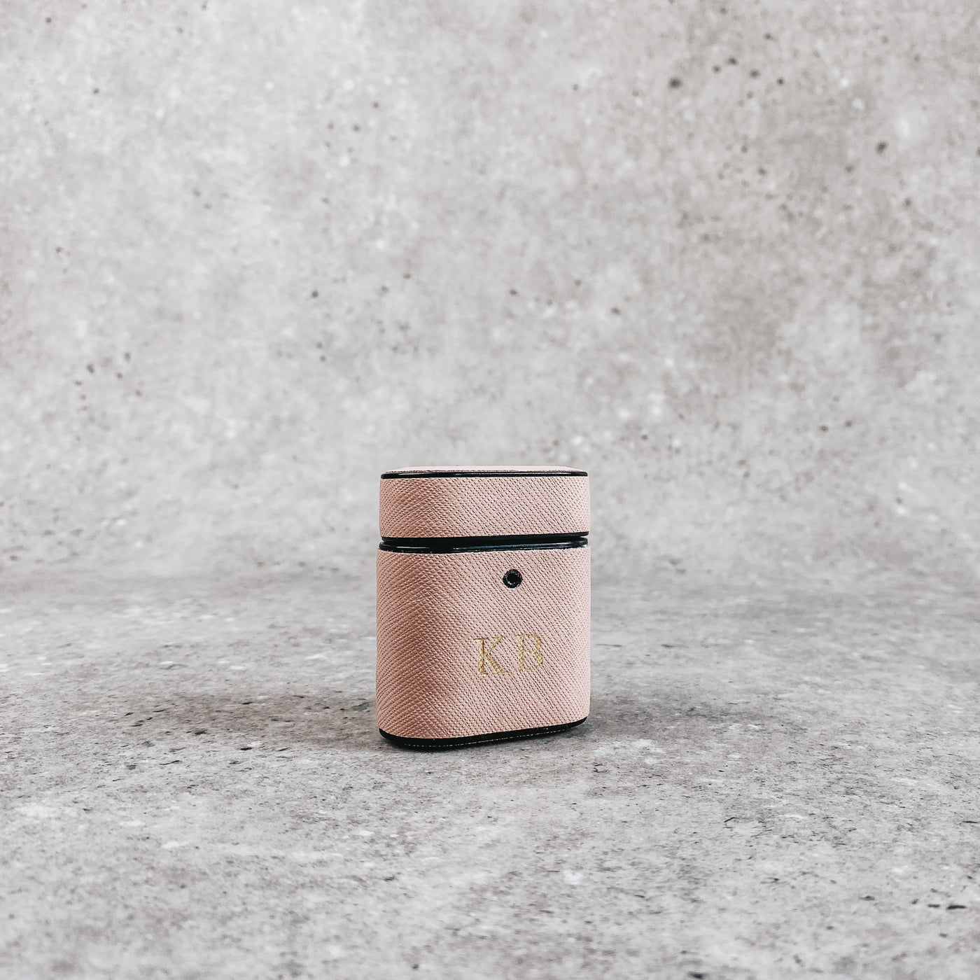 Pink AirPod holder, embossed with gold initials